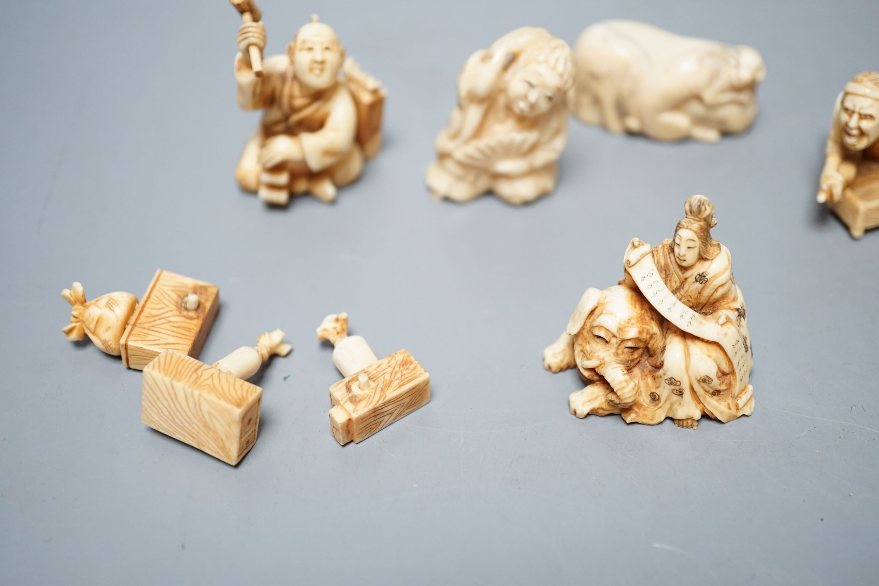 A collection of eight Japanese Ivory and bone Netsuke and okimono, 19th/early 20th century